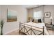 A cozy bedroom features a metal frame bed and natural light at 861 Watling St, Fort Mill, SC 29715