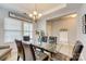 Elegant dining room with modern chandelier and hardwood floors at 861 Watling St, Fort Mill, SC 29715