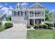 Charming two-story home with a two-car garage, dormer windows, and a welcoming front porch at 861 Watling St, Fort Mill, SC 29715
