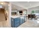 Open concept kitchen with island, stainless steel appliances, and seamless view into the living room at 861 Watling St, Fort Mill, SC 29715