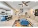 Bright, open living room features an eat-in kitchen, hardwood floors, and stairs to the second level at 861 Watling St, Fort Mill, SC 29715