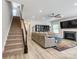Spacious living room with hardwood floors, fireplace, and stairs at 861 Watling St, Fort Mill, SC 29715