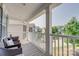 Covered porch with cozy seating, white railings, and views of the neighborhood at 861 Watling St, Fort Mill, SC 29715