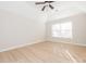 Bedroom featuring wood-look flooring, a ceiling fan, and a window with blinds at 8718 Rittenhouse Cir, Charlotte, NC 28270