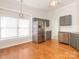 Bright kitchen with stainless steel appliances, gray cabinets, hardwood floors and natural light at 8718 Rittenhouse Cir, Charlotte, NC 28270