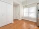 Open kitchen with hardwood floors, stainless steel refrigerator, breakfast nook and ample natural light at 8718 Rittenhouse Cir, Charlotte, NC 28270