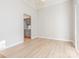 Room featuring light-colored wood-look flooring and an open view of the kitchen at 8718 Rittenhouse Cir, Charlotte, NC 28270
