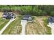 Aerial view of a neighborhood showcasing large homes with spacious lawns and well-manicured landscaping at 8756 Sherrills Ford Rd, Sherrills Ford, NC 28673