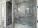 Bathroom with a modern glass enclosed shower with marble surround. Luxury fixtures and modern design at 8756 Sherrills Ford Rd, Sherrills Ford, NC 28673