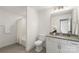 Well-lit bathroom featuring a shower-tub combination, a granite-topped vanity, and white cabinets at 8756 Sherrills Ford Rd, Sherrills Ford, NC 28673