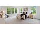 Bright bedroom featuring a large window, plush carpet, and tastefully coordinated decor at 8756 Sherrills Ford Rd, Sherrills Ford, NC 28673