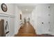 Hallway featuring pristine hardwood floors, white trim, and elegant decor at 8756 Sherrills Ford Rd, Sherrills Ford, NC 28673