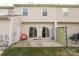This backyard features a concrete patio, sliding glass doors to bring outdoor living at 9668 Walkers Glen Nw Dr, Concord, NC 28027