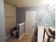 This bathroom features neutral walls, vanity with sink, toilet, door to add functionality and style at 9668 Walkers Glen Nw Dr, Concord, NC 28027