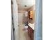 This bathroom features a vanity with sink, tub-shower with curtain and shelves for functionality at 9668 Walkers Glen Nw Dr, Concord, NC 28027