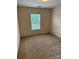 Cozy bedroom with natural light and neutral carpet at 9668 Walkers Glen Nw Dr, Concord, NC 28027