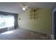 Bedroom featuring a ceiling fan, window and built-in shelving at 9668 Walkers Glen Nw Dr, Concord, NC 28027