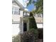 Charming exterior view with front door framed by decorative shrubs and a small tree at 9668 Walkers Glen Nw Dr, Concord, NC 28027