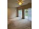 Bright living room with sliding glass doors to the backyard at 9668 Walkers Glen Nw Dr, Concord, NC 28027