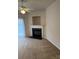 Comfortable living room featuring a fireplace and a ceiling fan at 9668 Walkers Glen Nw Dr, Concord, NC 28027