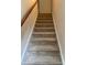 Carpeted stairs leading to the upper level of the house at 9668 Walkers Glen Nw Dr, Concord, NC 28027