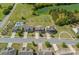 Aerial view of suburban street with well-manicured lawns, mature trees, and landscaped yards at 9867 Travertine Trl, Davidson, NC 28036