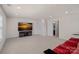 Spacious carpeted basement featuring a media center and a convenient adjacent bathroom at 9867 Travertine Trl, Davidson, NC 28036