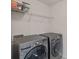 Laundry room with front load washer and dryer, with wire shelving at 9867 Travertine Trl, Davidson, NC 28036