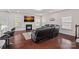 Inviting living room with a fireplace, comfortable seating, and hardwood floors at 9867 Travertine Trl, Davidson, NC 28036
