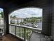 Relaxing balcony view overlooking parking area and other well maintained condominium buildings at 10005 Graduate Ln, Charlotte, NC 28262