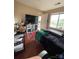 Cozy bedroom with a large window, red accent rug and a television on shelving at 10005 Graduate Ln, Charlotte, NC 28262