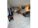 Comfortable living area boasts a television, tile flooring and relaxed seating arrangement at 10005 Graduate Ln, Charlotte, NC 28262