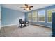 Bedroom featuring large windows and a desk at 10056 Paisley Dr, Charlotte, NC 28269