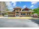 Community clubhouse featuring stone accents, decorative windows, and a welcoming entrance for residents at 10056 Paisley Dr, Charlotte, NC 28269