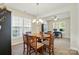 Bright dining area with space for study or home office, featuring a round table and ample natural light at 10056 Paisley Dr, Charlotte, NC 28269