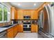 Well-lit kitchen with stainless steel appliances, granite countertops, and ample cabinet space at 10056 Paisley Dr, Charlotte, NC 28269
