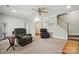 Living room featuring hardwood floors, seating, and a staircase at 10056 Paisley Dr, Charlotte, NC 28269