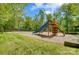 Community playground featuring multiple slides, climbing structures, and a safe, cushioned surface for play at 10056 Paisley Dr, Charlotte, NC 28269