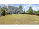 Large fenced backyard with expansive lawn, patio, and outdoor living space at 10354 Scotland Ave, Fort Mill, SC 29707