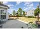 Backyard featuring a large, well-maintained lawn, a patio, and a wooden fence at 10354 Scotland Ave, Fort Mill, SC 29707