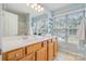 Bathroom featuring double sinks, stylish fixtures, large windows and a tub at 10354 Scotland Ave, Fort Mill, SC 29707