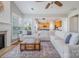 Bright and airy living room with hardwood floors, a fireplace, and lots of natural light at 10354 Scotland Ave, Fort Mill, SC 29707