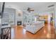 Bright living room with a fireplace, hardwood floors, and large windows that offer plenty of natural light at 10354 Scotland Ave, Fort Mill, SC 29707