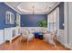 Elegant sitting room with blue walls, hardwood floors, and natural lighting at 10354 Scotland Ave, Fort Mill, SC 29707
