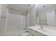Bathroom featuring a shower over the bathtub and a white vanity at 10526 Hill Point Ct, Charlotte, NC 28262