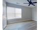 Bedroom with wood floors, a ceiling fan and natural light at 10526 Hill Point Ct, Charlotte, NC 28262