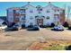 Well-maintained condo building featuring balconies and ample parking at 10526 Hill Point Ct, Charlotte, NC 28262