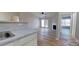 Open concept living area with an eat-in bar, cozy fireplace, and access to a balcony creating inviting space at 10526 Hill Point Ct, Charlotte, NC 28262