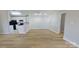 Open-concept living area with hardwood floors and natural light; a perfect space for relaxation and entertaining at 10526 Hill Point Ct, Charlotte, NC 28262