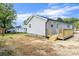 Backyard view showing the rear exterior with a deck and shed at 109 W Poplar St, Stanley, NC 28164